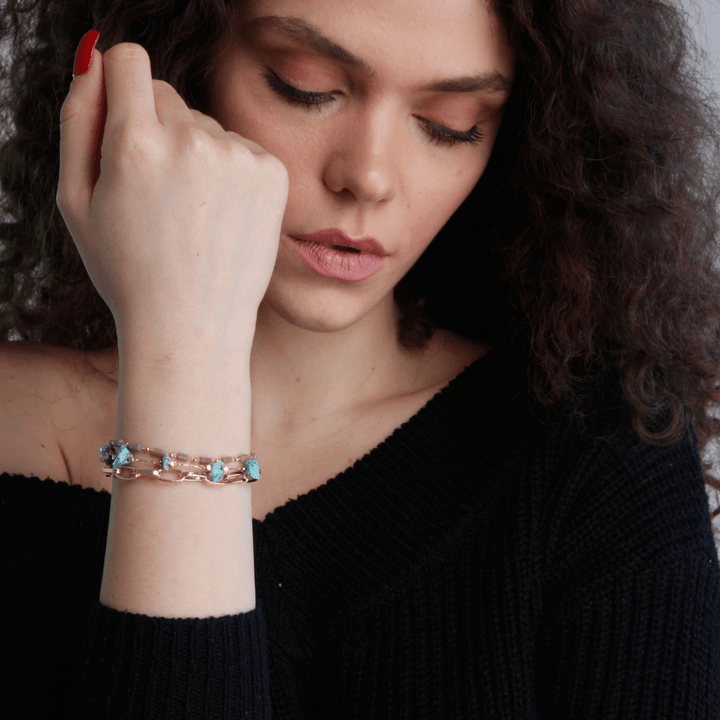Fashionable women's bracelet with multiple strands of turquoise and opal gemstones.