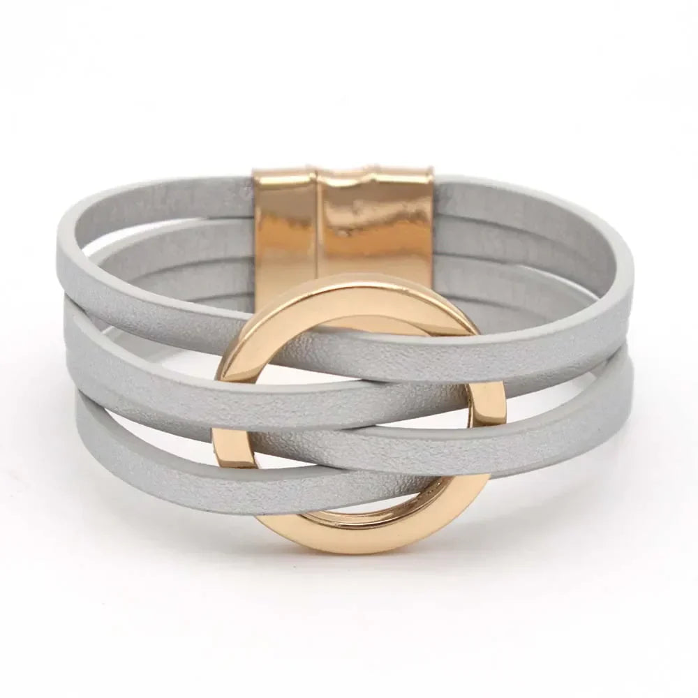 Adjustable women's leather wrap bracelet, multi-strand boho chic design with a delicate heart charm.