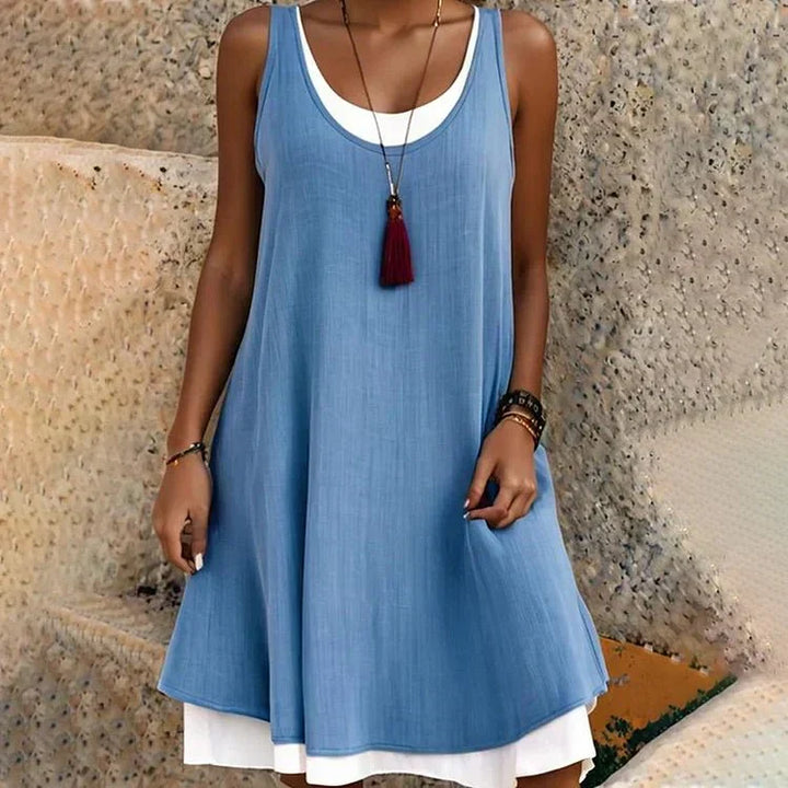 Stylish women's sleeveless mini swing dress with faux layered design and scoop neck, ideal for versatile summer outfits.