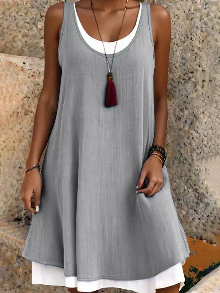 Casual A-line mini dress for women, featuring a sleeveless scoop neck and layered look, great for summer events.