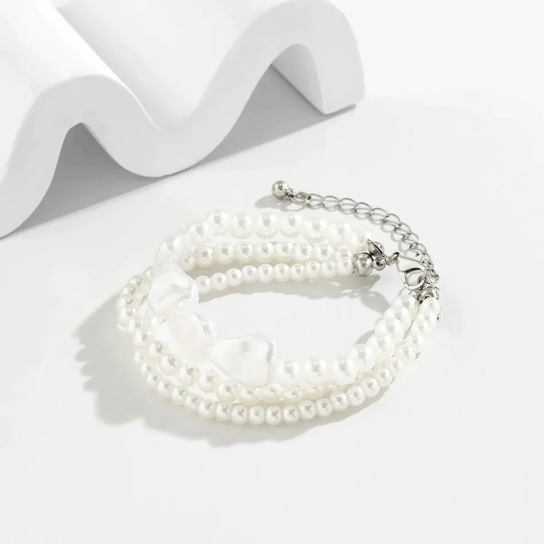 Delicate layered pearl bracelet for women, adjustable design with beautiful freshwater pearls & stainless steel finish.