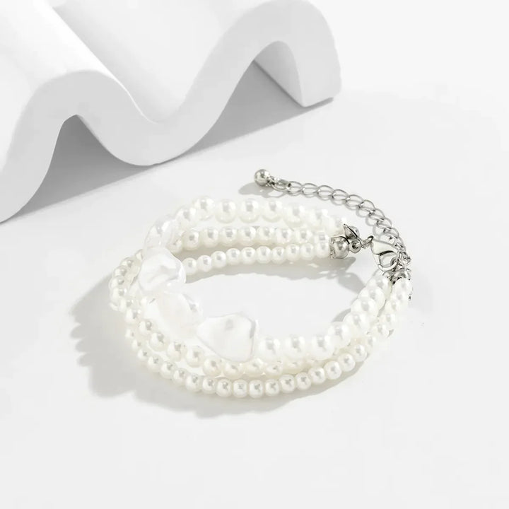 Delicate layered pearl bracelet for women, adjustable design with beautiful freshwater pearls & stainless steel finish.