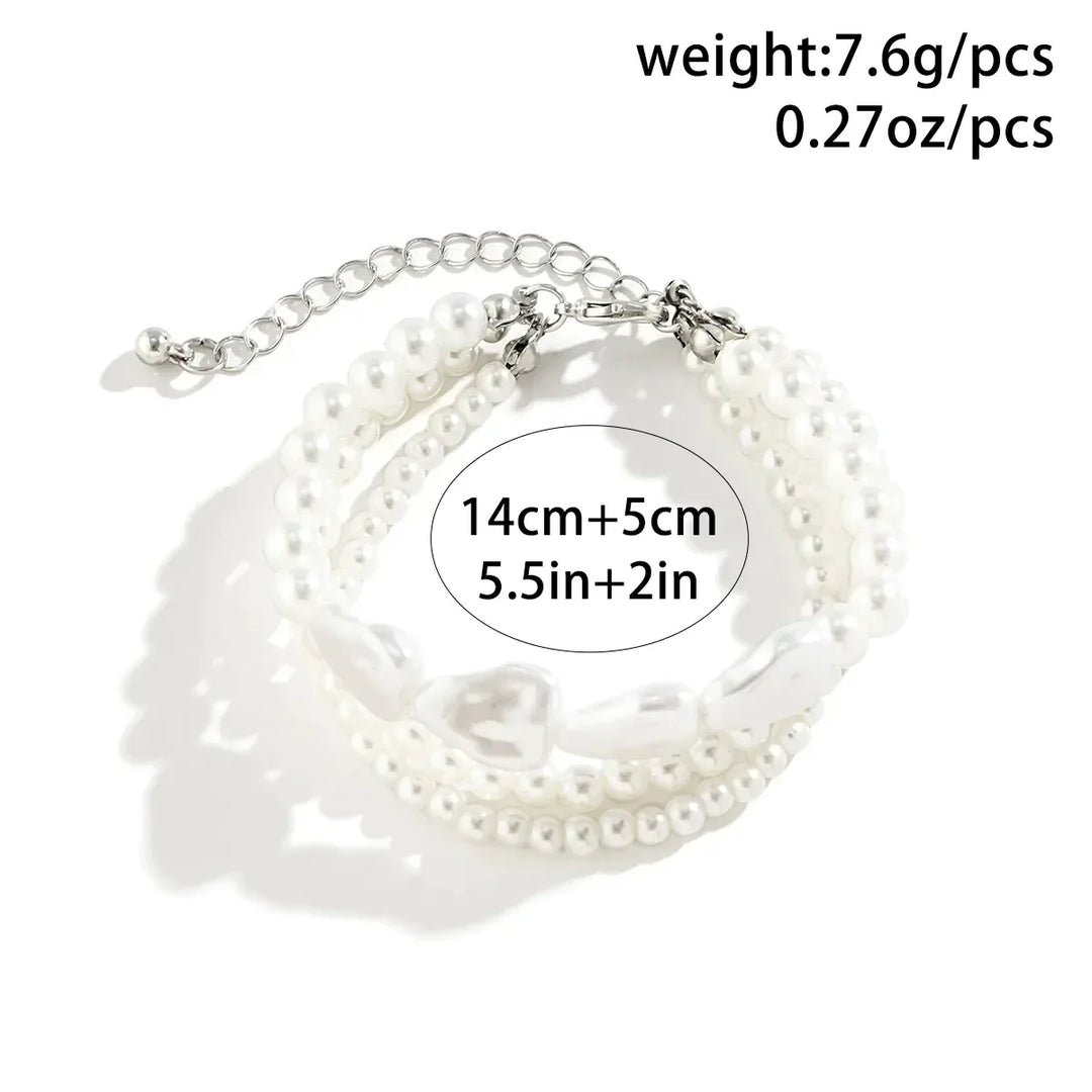 Stunning elegant layered pearl bracelet, a perfect gift for her. Features freshwater pearls & stainless steel.
