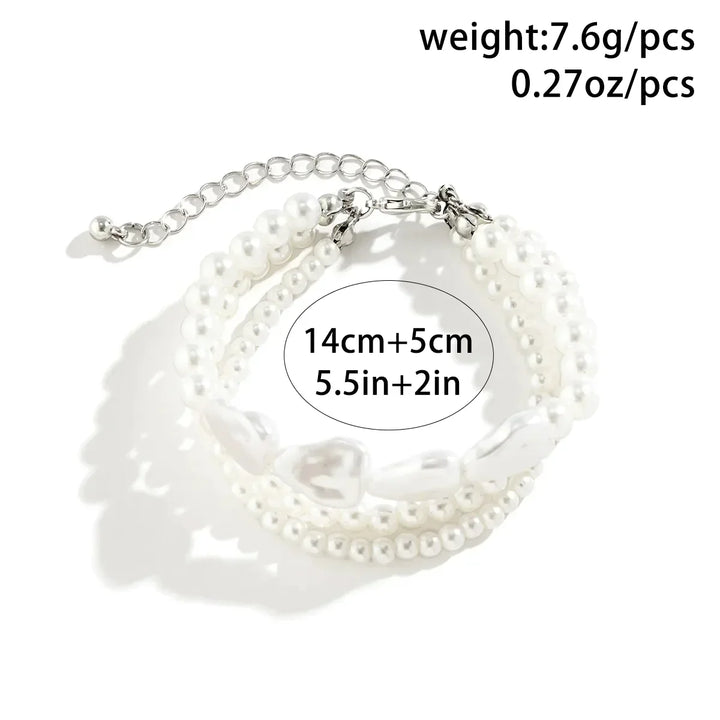 Stunning elegant layered pearl bracelet, a perfect gift for her. Features freshwater pearls & stainless steel.