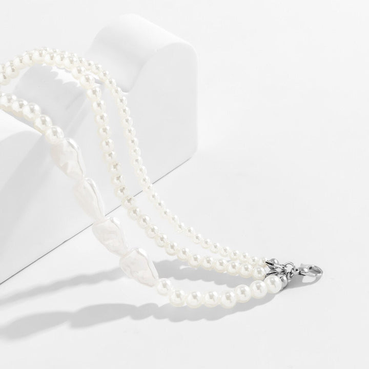 Close-up of a women's layered pearl bracelet, showcasing multiple strands of freshwater pearls on a delicate chain.