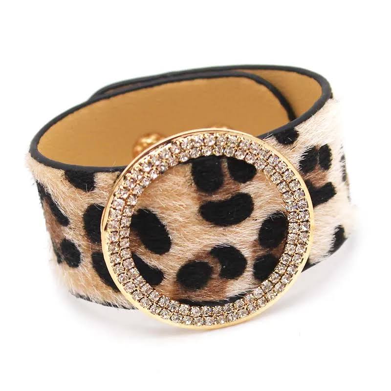 Close-up of women's leather wrap bracelet with vibrant leopard print