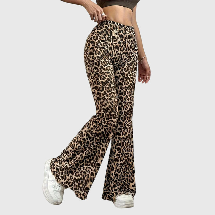 Elegant women's bootcut pants in a bold leopard print. Versatile high-waist design for flattering and trendy style.