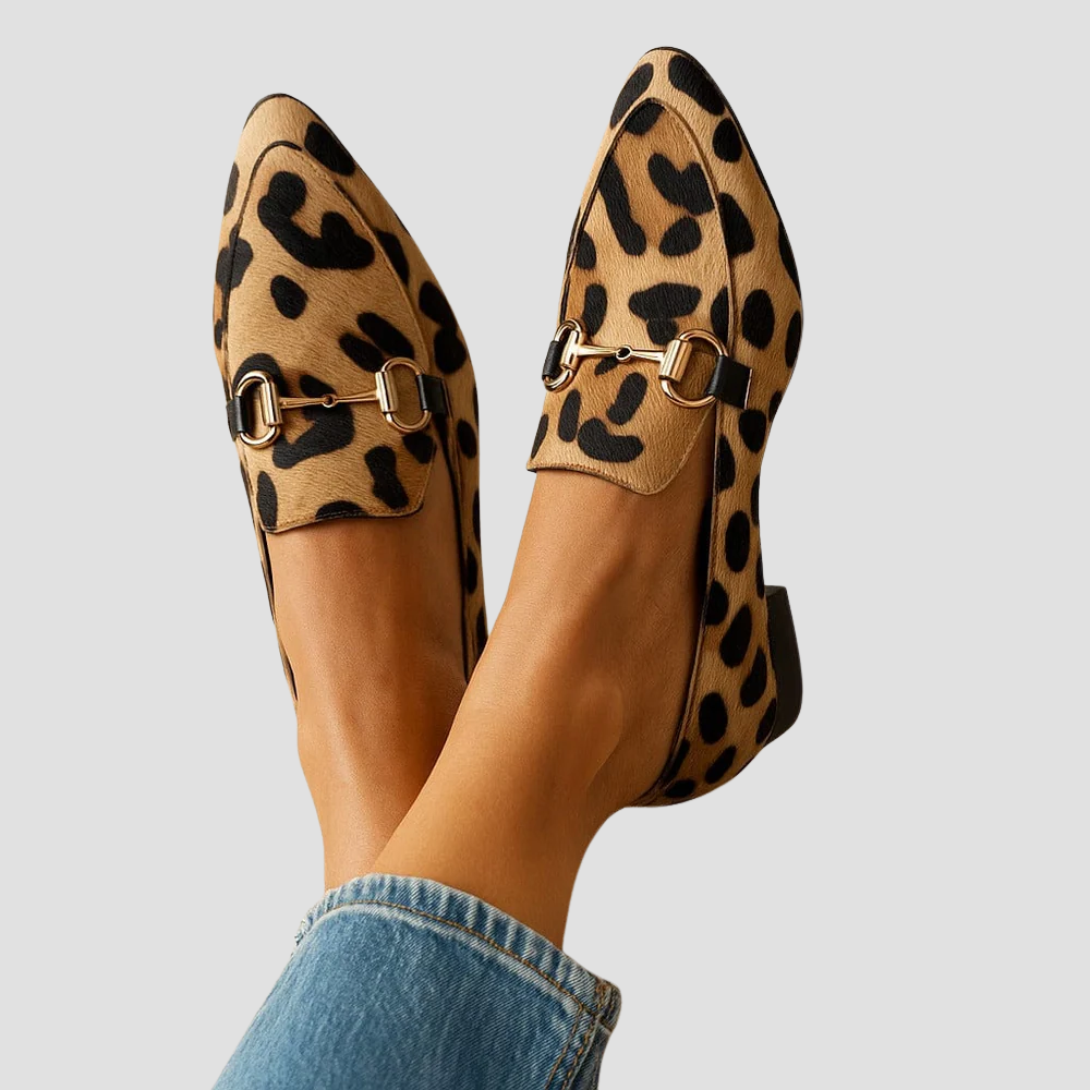 Women's leopard print pointed-toe loafers with a chic gold horsebit detail. Stylish slip-on flats for elegant fashion.