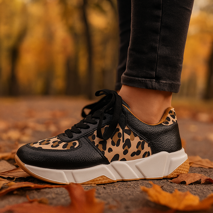 Fashionable women's leopard print athletic footwear, designed for running with orthopedic support & shock absorption.