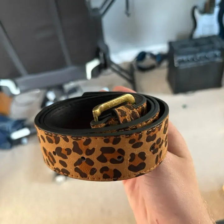 Fashionable women's leopard suede belt, a chic animal print statement accessory for her.