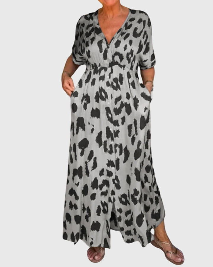 Chic women's leopard print flowy maxi dress, v-neck, button front. Comfortable & versatile for day or evening.