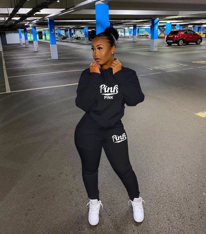 Stylish women's athletic two-piece tracksuit with trendy letter print, ideal for fall & spring fashion.