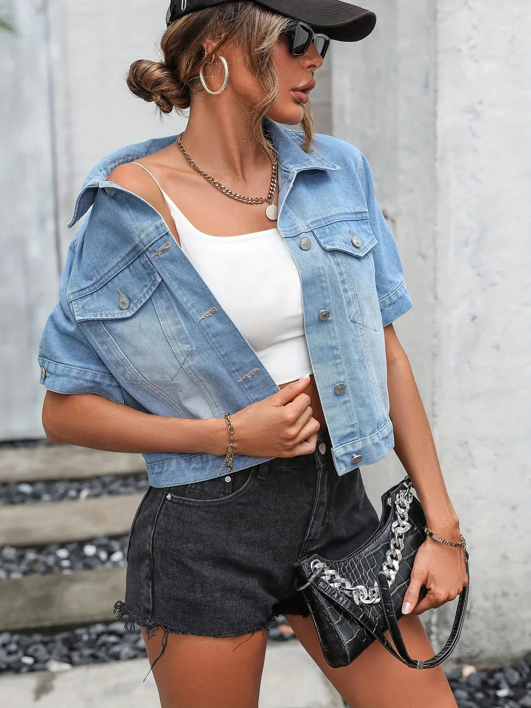 Light blue women's short sleeve denim jacket, relaxed fit, button-down, versatile for daily wear.