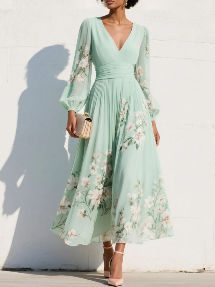 Women's light green floral midi dress with V-neck, elegant pleats & balloon sleeves, perfect for summer.
