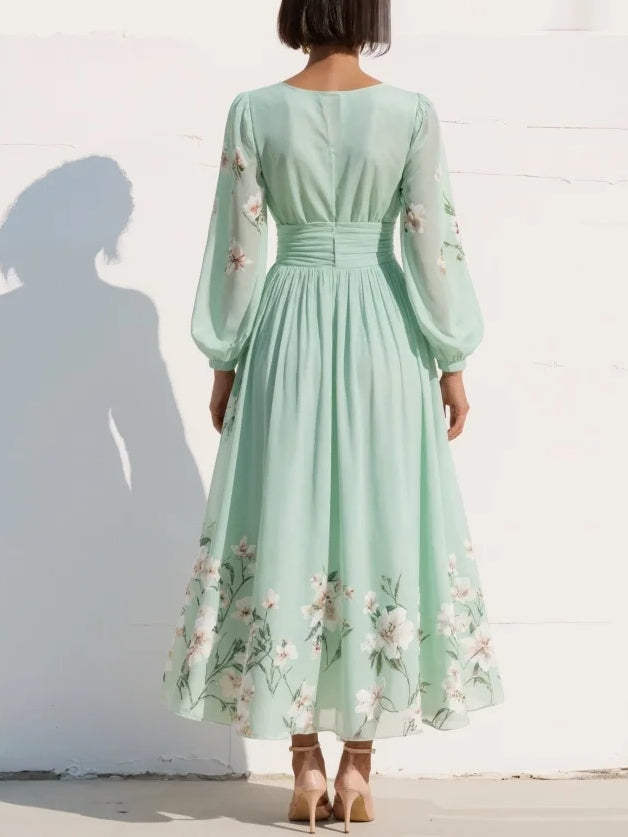 Light green V-neck floral midi dress for women, featuring elegant pleats, balloon sleeves & delicate embroidery.