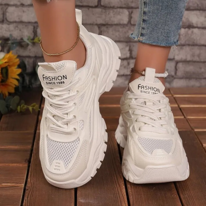 Durable women's athletic comfort footwear, engineered for lightweight support and all-day wear.