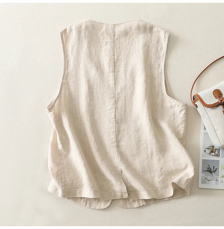 Stylish women's white cotton-linen vest. Sleeveless button-front design, lightweight & breathable for summer.