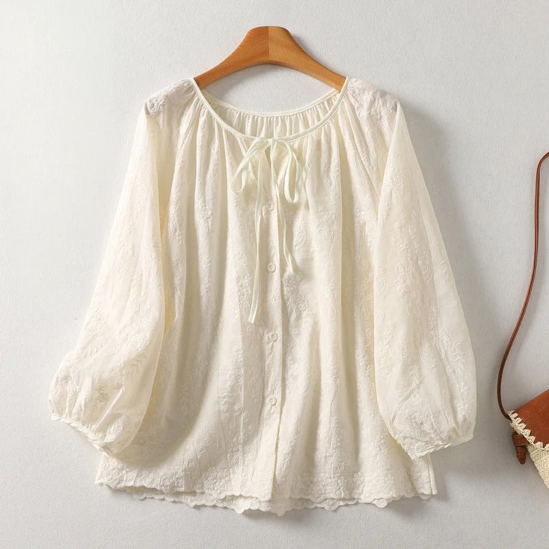 Women's lightweight embroidered blouse. Elegant casual summer top with intricate stitching and comfortable fit.