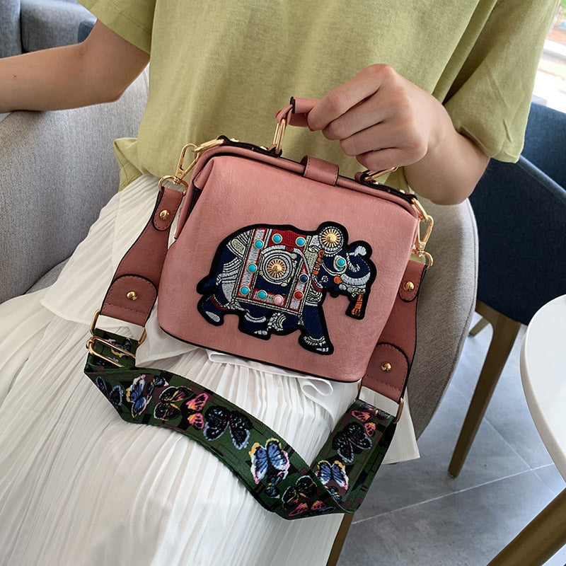 Vibrant embroidered mandala shoulder bag. Lightweight women's bohemian handbag in PU coated cotton.