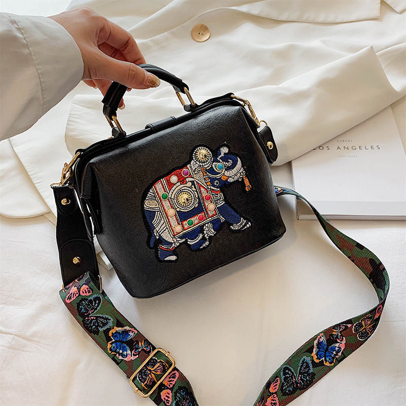 Women's lightweight bohemian handbag with intricate mandala embroidery. PU coated cotton.