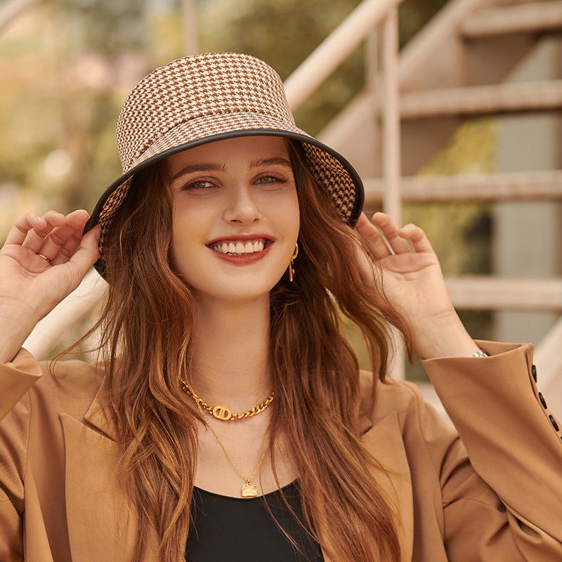 Coffee colored fabric bucket hat for women, a stylish and practical summer travel accessory.