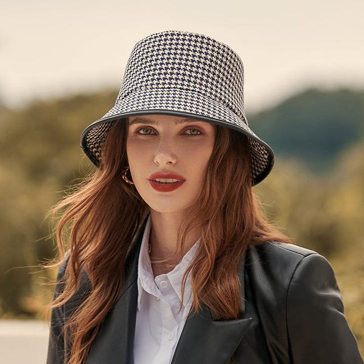 Black lightweight fabric bucket hat for women, ideal for sun protection and everyday summer wear.