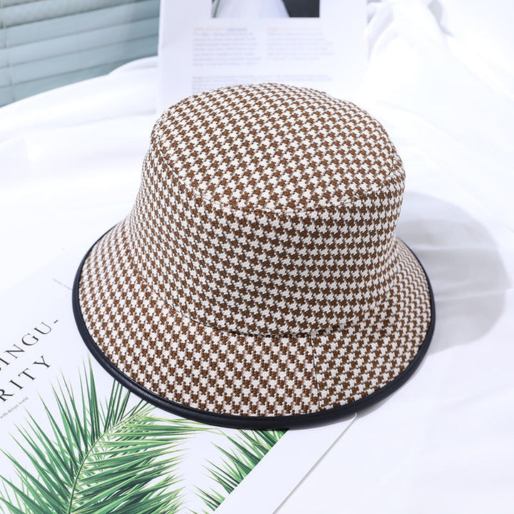 Casual women's coffee fabric bucket hat, offering sun protection and summer fashion appeal.
