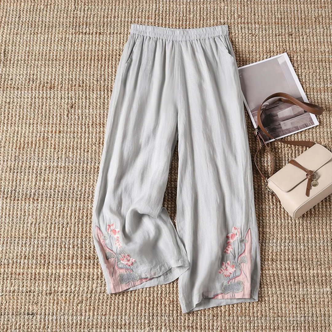 Flowy lightweight floral women's trousers in a breathable cotton blend, offering comfort and casual summer style.