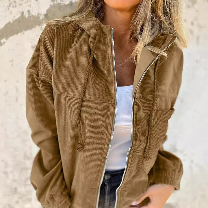 Woman wearing a green Regina hooded jacket, suitable for outdoor spring and autumn activities
