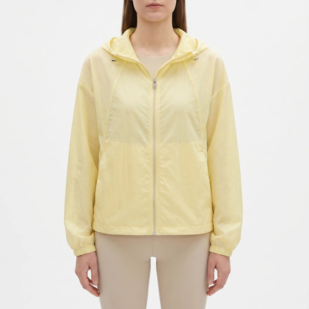 Casual women's hooded windbreaker jacket, lightweight & transitional, ideal for spring layering.