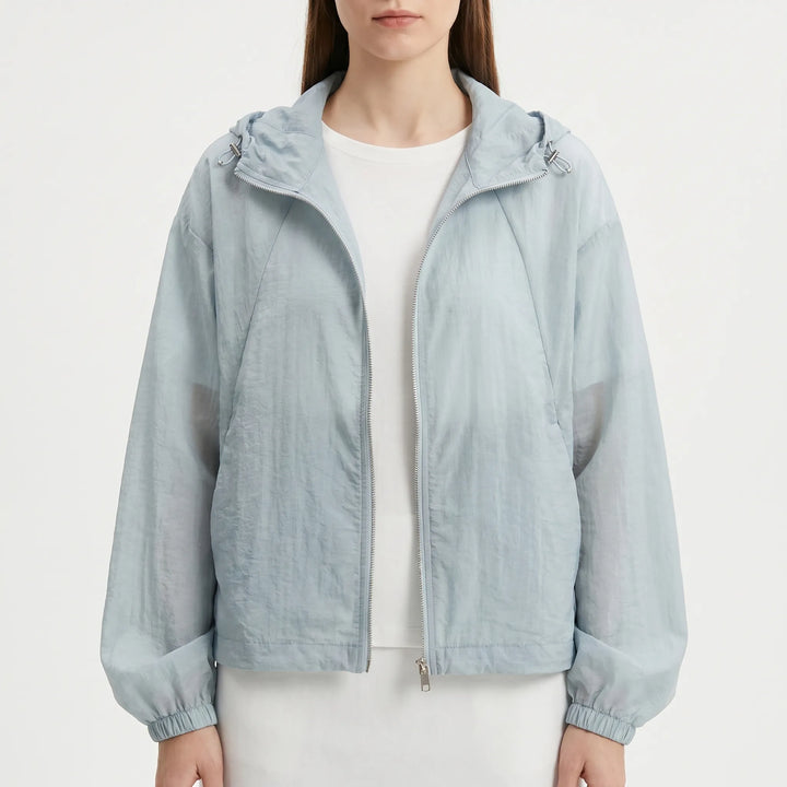 Durable women's lightweight hooded windbreaker jacket, full zip for spring & summer adventures.