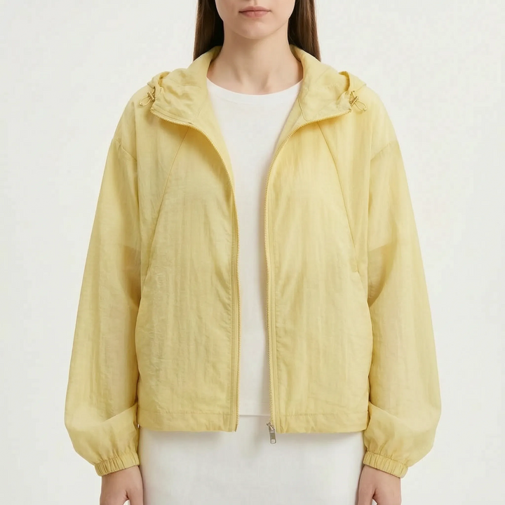 Versatile women's hooded windbreaker jacket, lightweight & colorful, perfect for transitional weather.