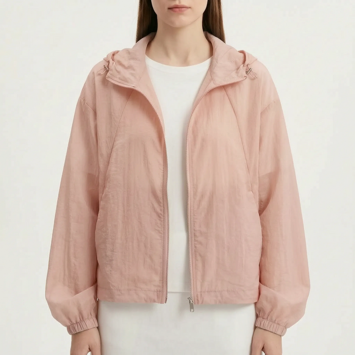 Comfortable women's lightweight hooded windbreaker, full zip, essential for active spring days.
