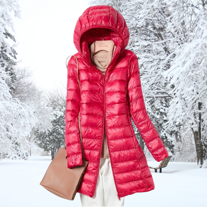 Women's lightweight insulated hooded jacket, a packable puffer for hiking and travel.