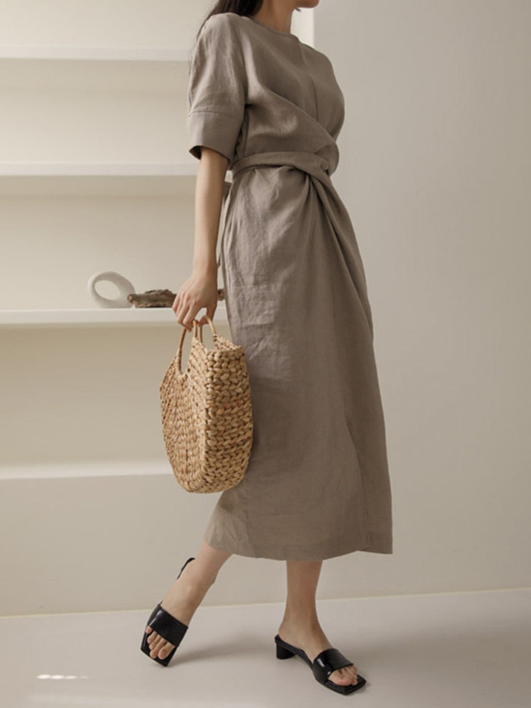 Lightweight khaki sleeveless dress for women, a summer midi style with a chic adjustable waist.