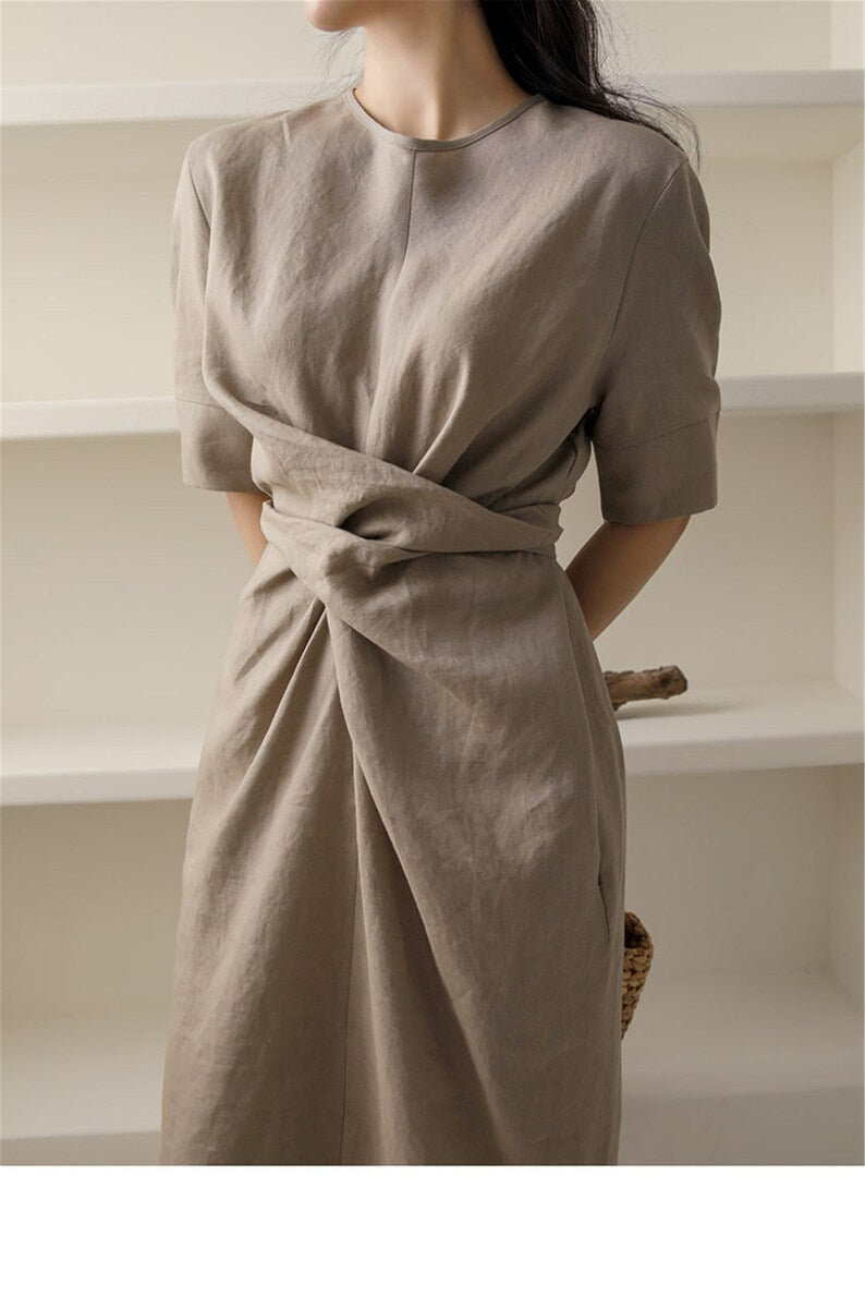 Fashionable women's khaki midi summer dress, sleeveless and lightweight with a customizable adjustable waist.