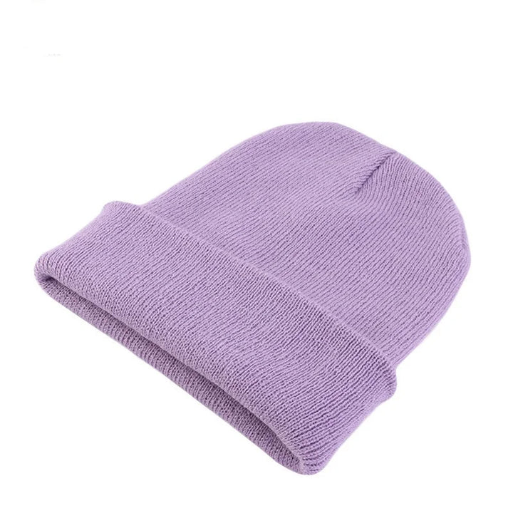 Solid color women's casual knit beanie, perfect lightweight winter accessory.