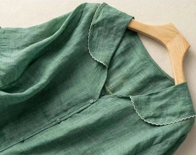 Stylish women's linen top, ideal for a casual chic look. Lightweight and breathable for summer comfort.