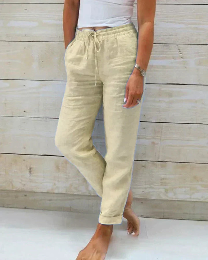 Woman modeling Hannah lightweight linen trousers. Comfortable, breathable summer pants. Casual women's fashion.