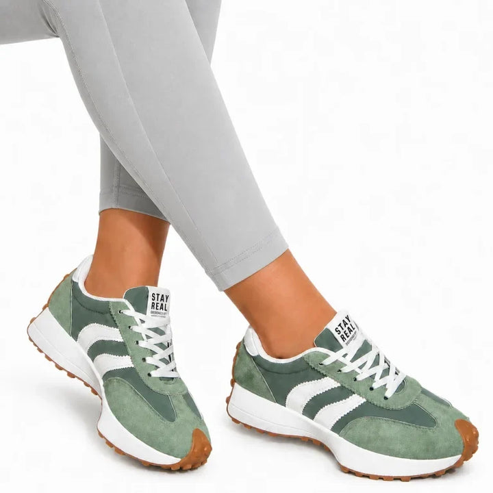 Back view of women's comfort trainers, showing supportive heel design.