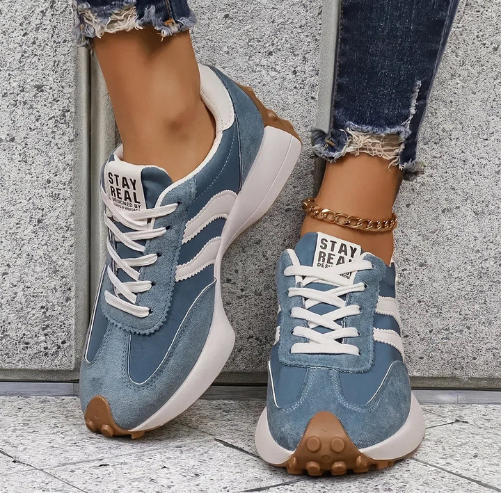 Supportive women's walking shoes featuring a wide toe box & breathable fabric.