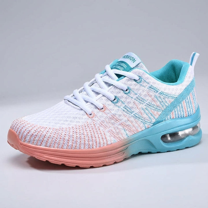 Side view of women's pink lightweight sneakers, breathable mesh upper, providing orthopedic comfort