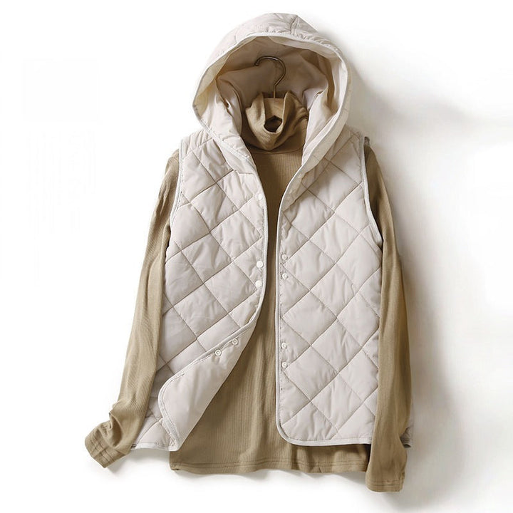 Women's lightweight quilted hooded vest, a stylish layering piece perfect for casual fall fashion.