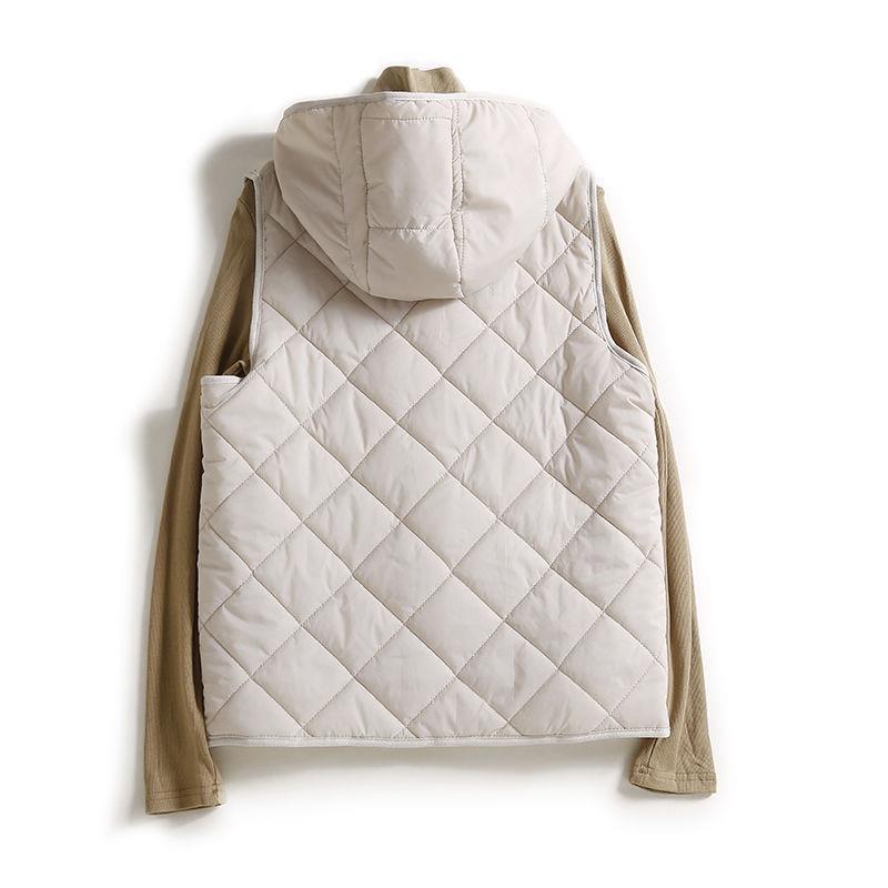 Brown women's hooded quilted vest, offering cozy warmth and modern style as a fall outerwear piece.