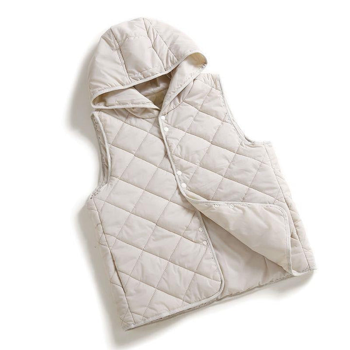Stylish women's quilted hooded vest. Lightweight and perfect for versatile layering in fall fashion.