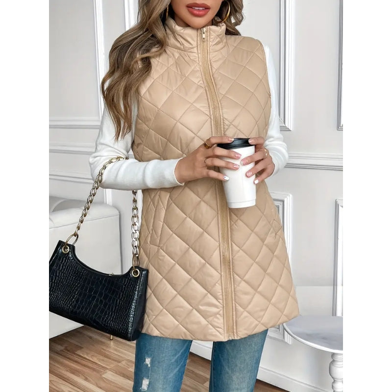 Cream women's padded vest with zip-up front, ideal casual outerwear for cool weather.