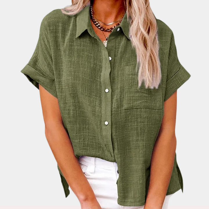 Casual ladies' short-sleeved blouse with a button front and a front pocket, ideal for warm weather.