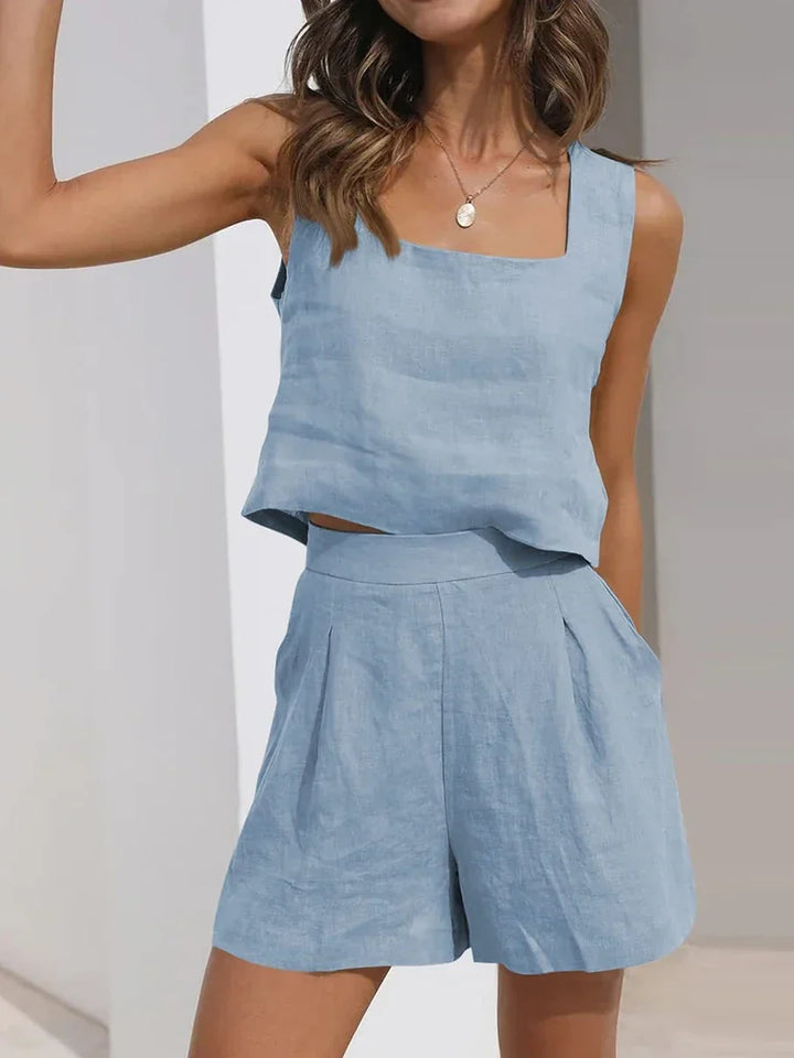 Trendy women's two-piece summer fashion set, featuring a sleeveless crop top and comfy shorts.
