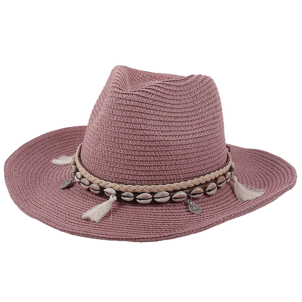 Women's vacation essential straw hat with shell embellishments and tassels, offering chic sun protection.
