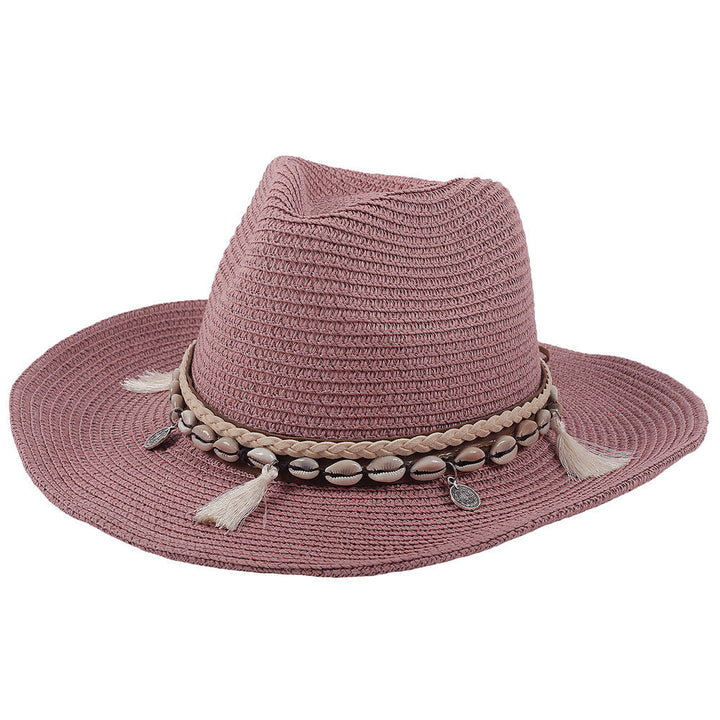 Women's vacation essential straw hat with shell embellishments and tassels, offering chic sun protection.